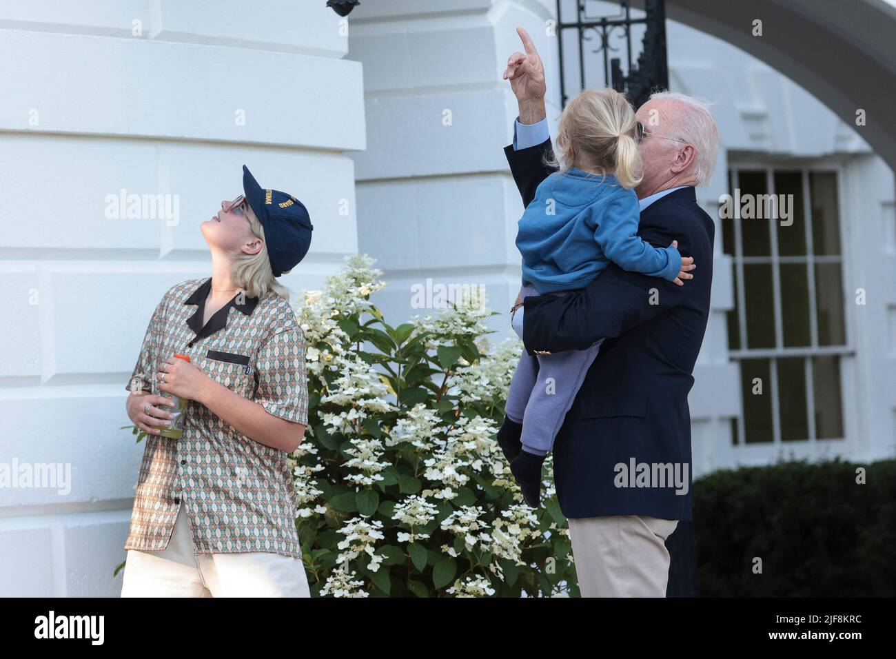 President Joe Biden lifts his grandson Beau Biden, center, the son of Hunter Biden, as granddaughter Maisy Biden, left, watches, after Biden returned to Washington, DC on June 30, 2022. Biden returned to Washington after attending summits in Germany and Spain. Photo by Oliver Contreras/Pool/ABACAPRESS.COM Stock Photo