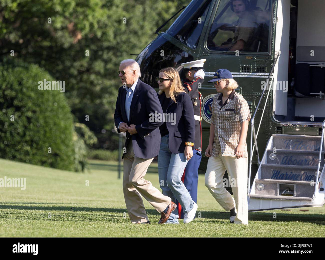U.S. President Joe Biden walks to the White House with his granddaughters Finnegan and Maisy Biden, after arriving at the White House following his trip to Europe, in Washington, U.S., June 30, 2022. REUTERS/Evelyn Hockstein Stock Photo
