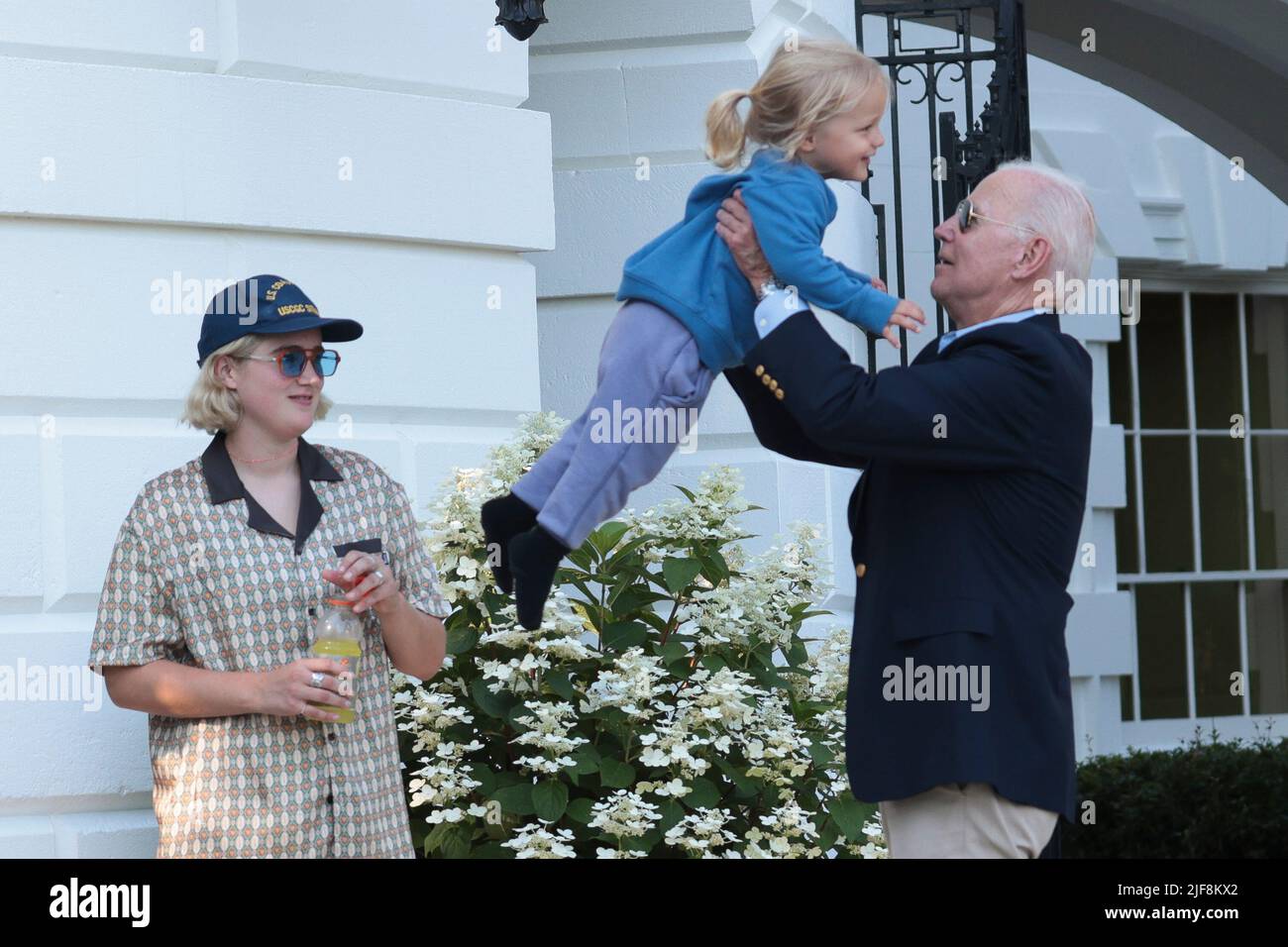 Washington, USA. 30th June, 2022. President Joe Biden lifts his grandson Beau Biden, center, the son of Hunter Biden, as granddaughter Maisy Biden, left, watches, after Biden returned to Washington, DC on June 30, 2022. Biden returned to Washington after attending summits in Germany and Spain. (Photo by Oliver Contreras/SIPA USA) Credit: Sipa USA/Alamy Live News Stock Photo