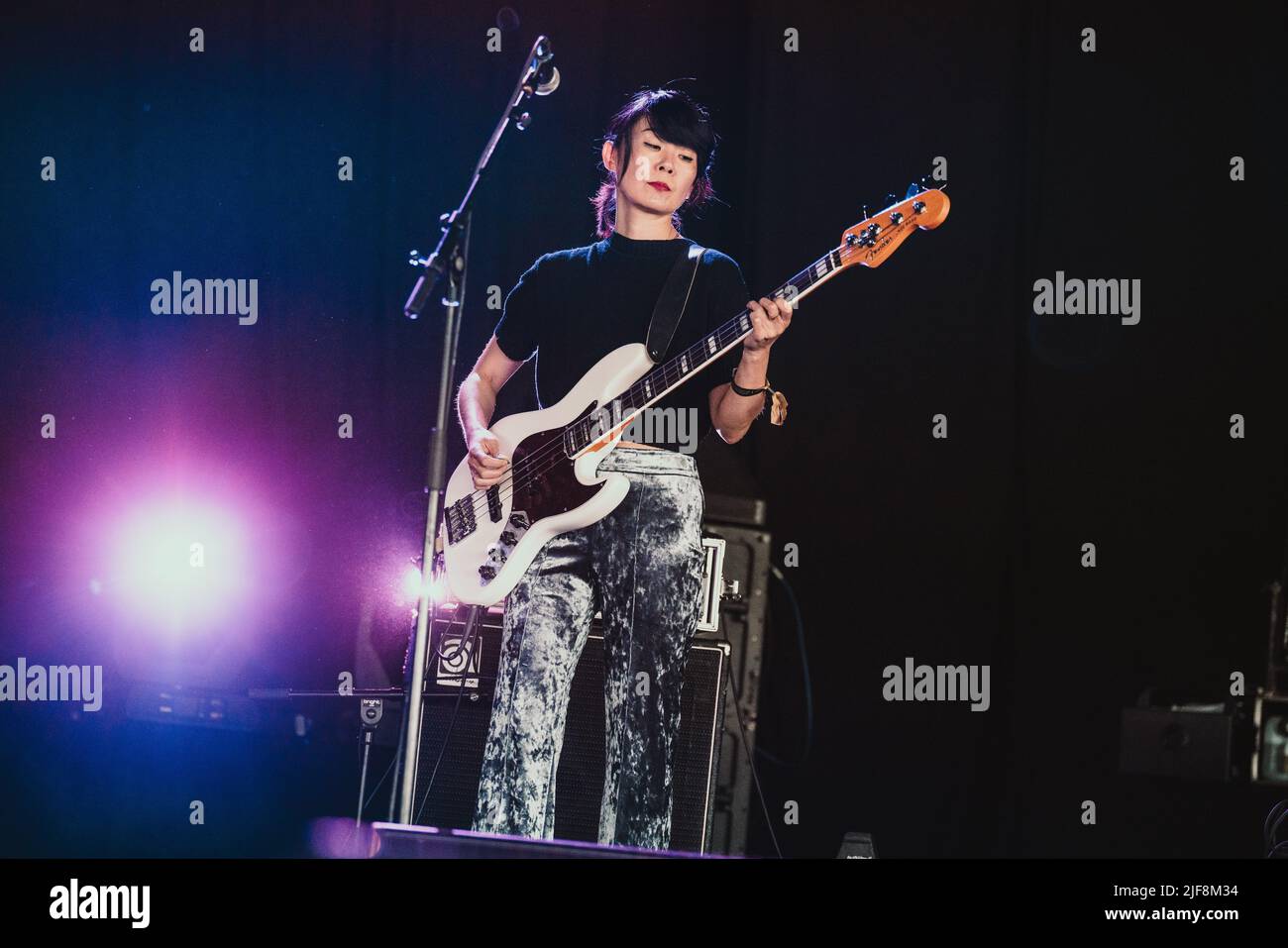 Roskilde, Denmark. 30th June, 2022. Bass player Toko Yasuda performs live with the Welsh singer and musician Cate Le Bon during the Danish music festival Roskilde Festival 2022 in Roskilde. (Photo Credit: Gonzales Photo/Alamy Live News Stock Photo