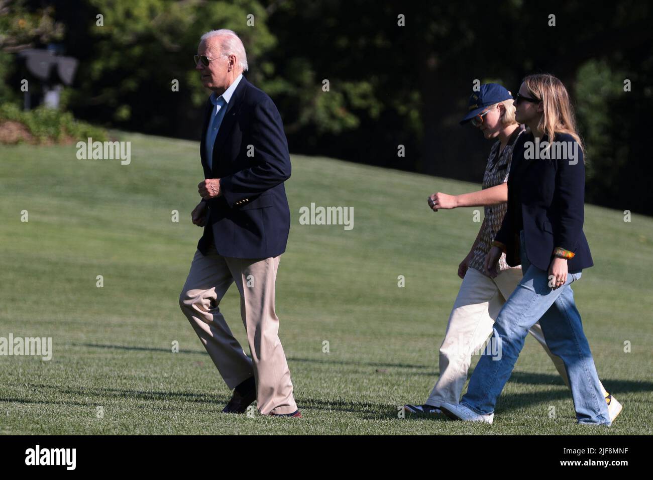 President Joe Biden, arrives on the South Lawn of the White House alongside his 2 granddaughters, Finnegan Biden and Maisy Biden, on June 30, 2022 in Washington, DC. Biden returned to Washington after attending summits in Germany and Spain.Photo by Oliver Contreras/Pool/ABACAPRESS.COM Stock Photo