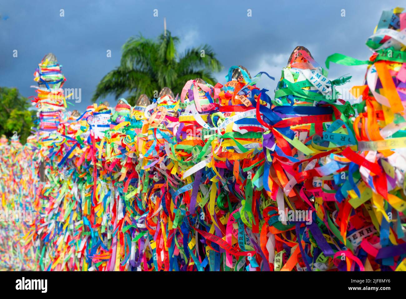 Colored ribbons attached to the iron grid. Salvador, Bahia, Brazil. Stock Photo