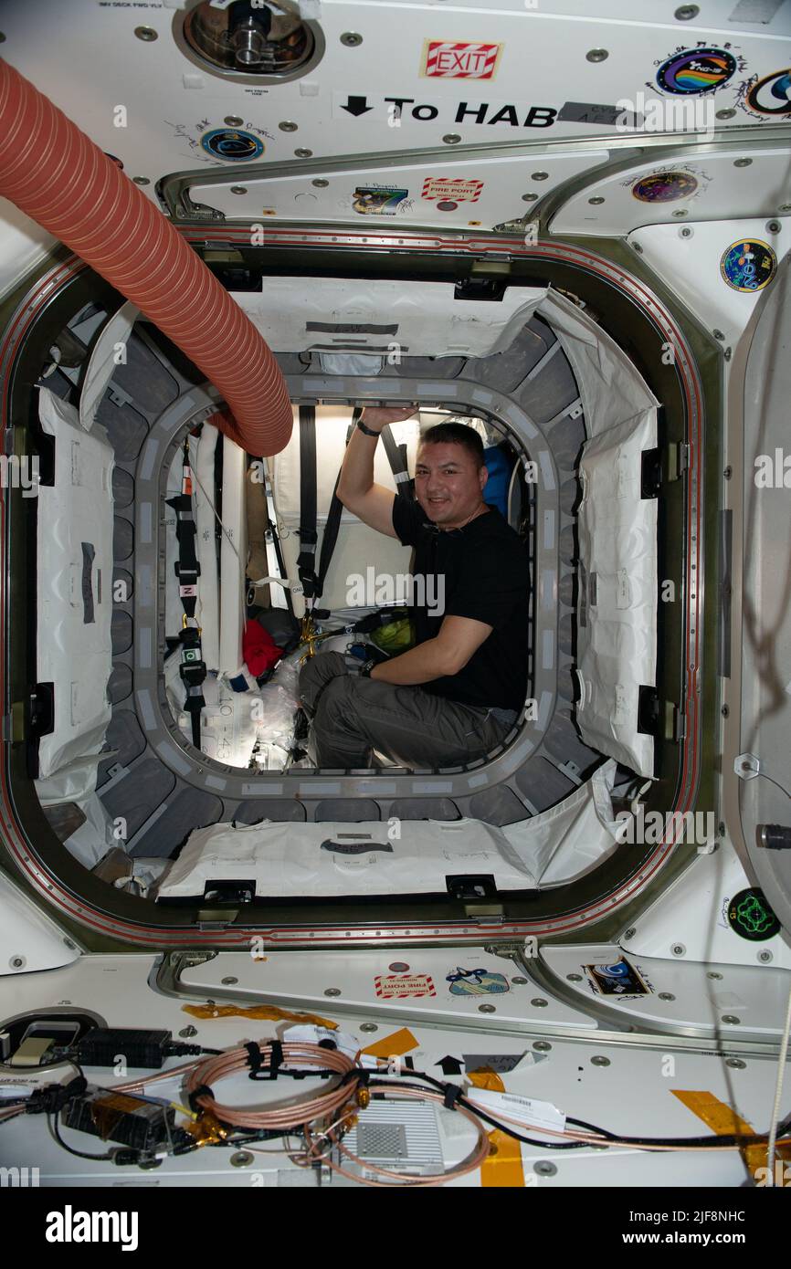 Earth Atmosphere. 27th June, 2022. NASA astronaut and Expedition 67 Flight Engineer Kjell Lindgren is pictured inside the vestibule between the Unity module and the Cygnus space freighter finalizing cargo operations the day before the vehicle's departure from the International Space Station. Credit: NASA/ZUMA Press Wire Service/ZUMAPRESS.com/Alamy Live News Stock Photo