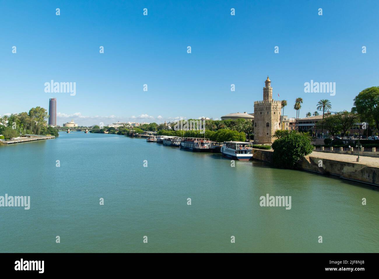 Panoramic view of Guadalquivir river, Sevilla. The Gold Tower (Torre de Oro) at the right. Stock Photo