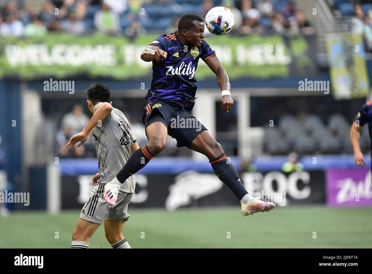 Seattle, WA, USA. 29th June, 2022. Seattle Sounders defender Nouhou Tolo in the air with a header during the MLS soccer match between CF Montreal and Seattle Sounders FC at Lumen Field in Seattle, WA. Montreal defeated Seattle 2-1. Steve Faber/CSM/Alamy Live News Stock Photo