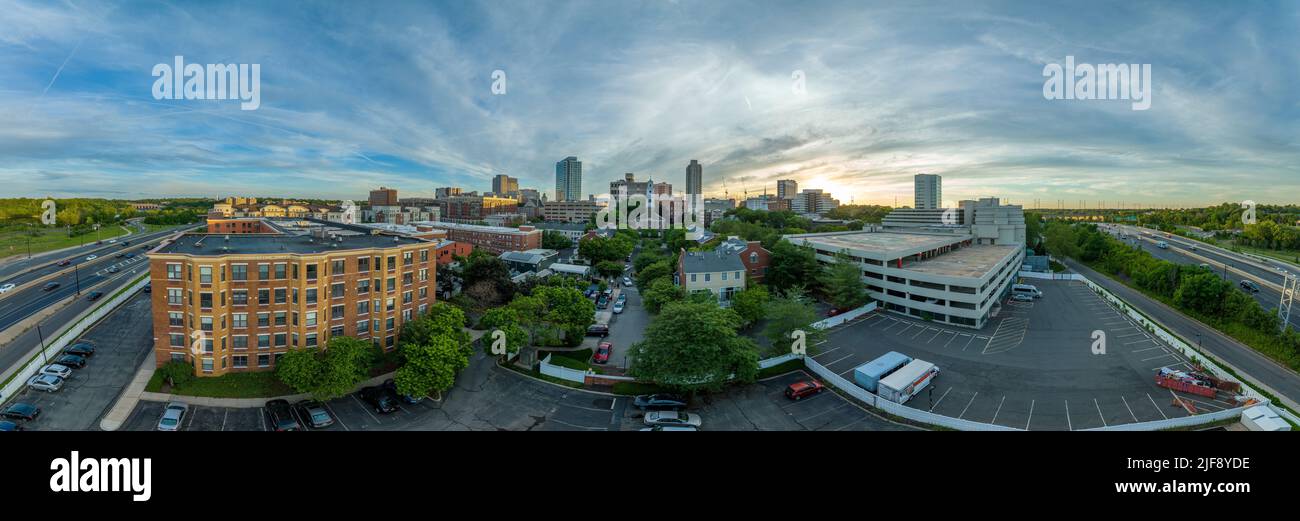 Aerial panoramic view of downtown New Brunswick, New Jersey apartment buildings and first reformed church, high rise office buildings, parking Stock Photo