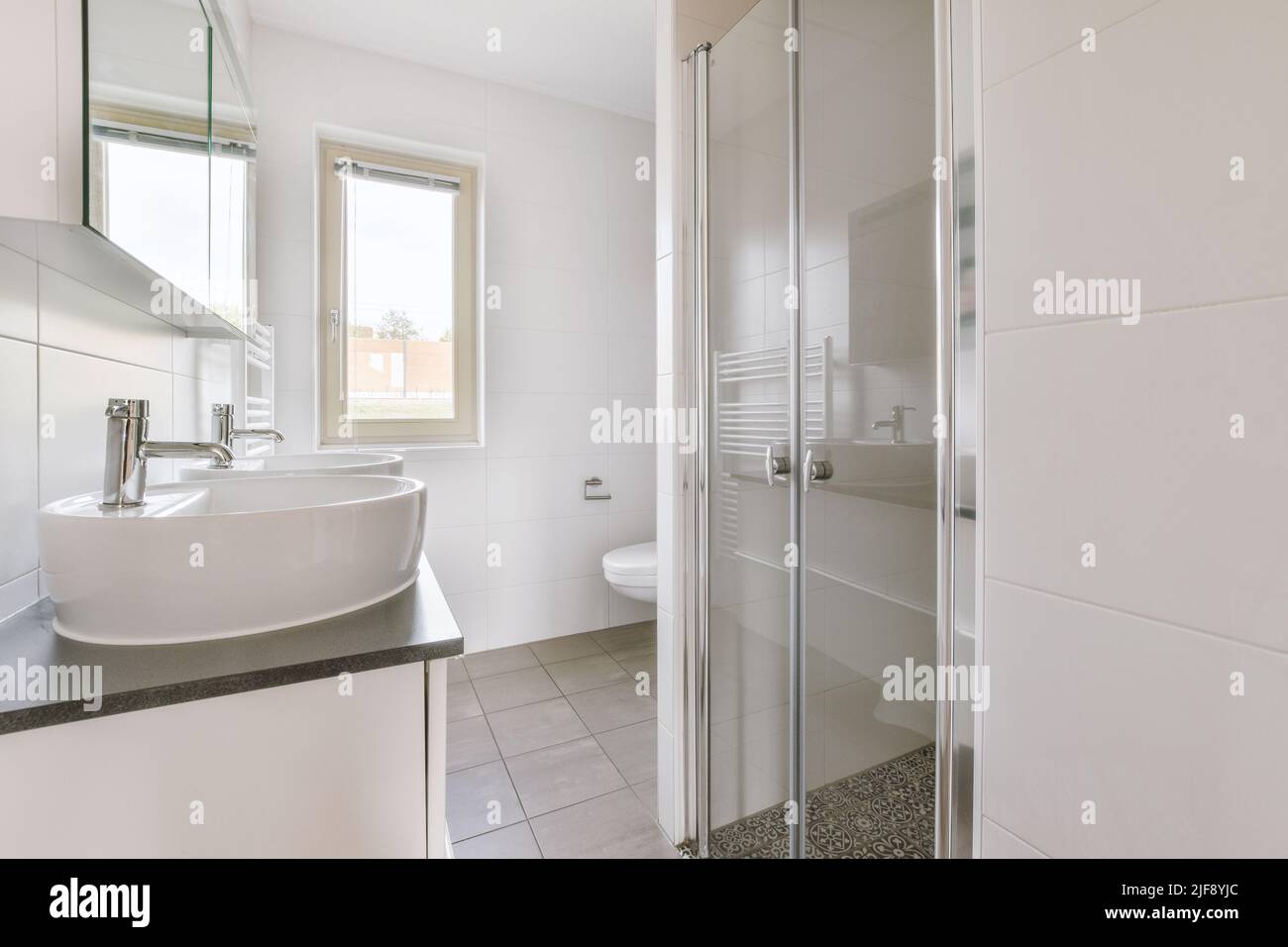 Interior of contemporary bathroom with shower place and toilet in minimal style flat Stock Photo