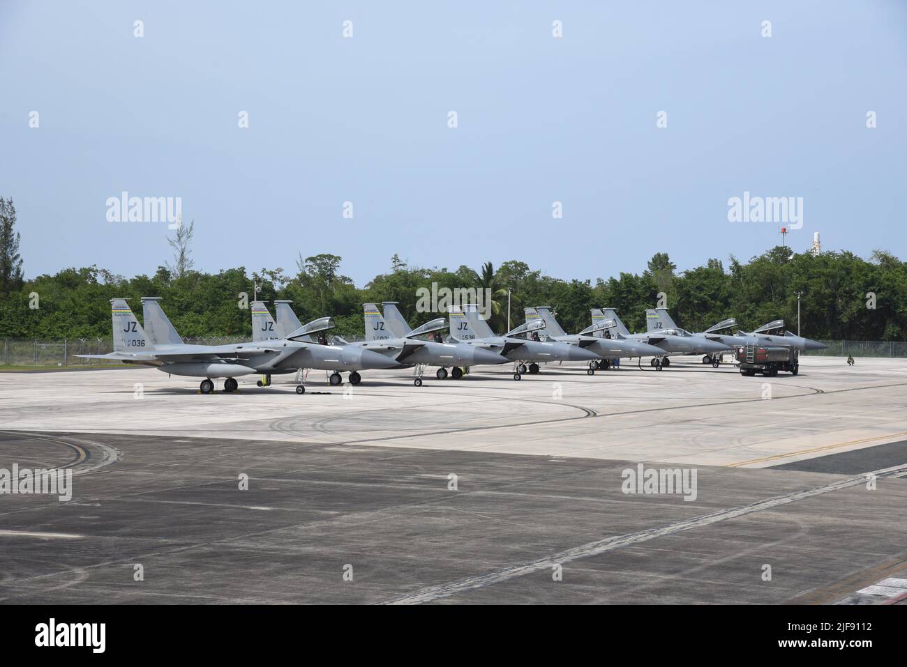 A group of F-15C Eagles sit in a row at Muniz Air National Guard Base in Carolina, Puerto Rico in support of North American Aerospace Defense Command’s (NORAD) Operation Noble Defender (OND), 27 June, 2022. As a part of OND, which is a recurring operation, the Continental U.S. NORAD Region (CONR) coordinated and conducted joint operations with the U.S. Navy while concurrently launching jets from different locations across the United States' gulf coast and Puerto Rico. OND, is an integrated air and missile defense operation designed to ensure the defense and security of the northern and souther Stock Photo