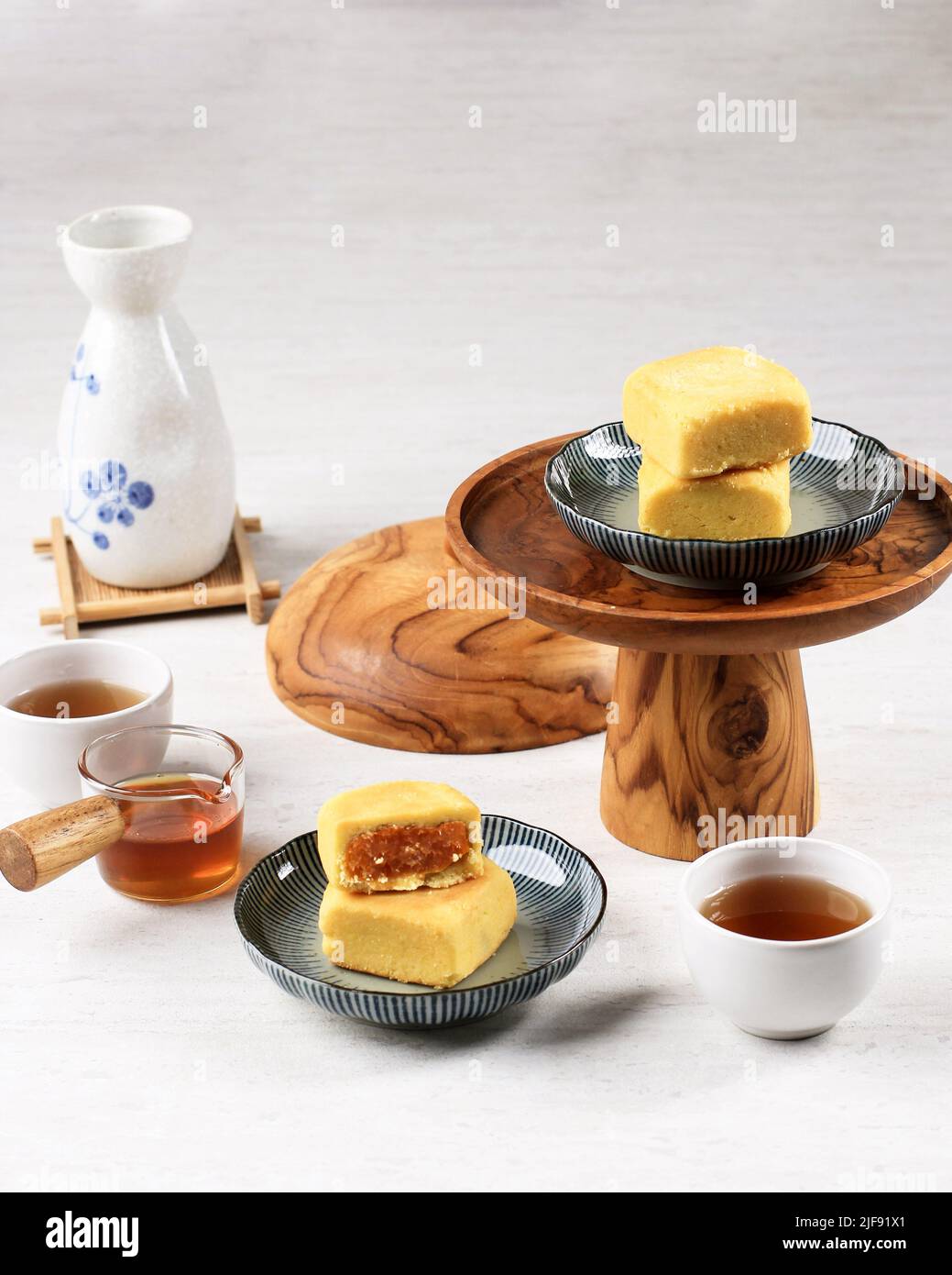 Pineapple Cake is a Sweet Traditional Taiwanese Pastry Containing Butter, Flour, Egg, Sugar, and Pineapple Jam. Served with Tea. Copy Space Stock Photo