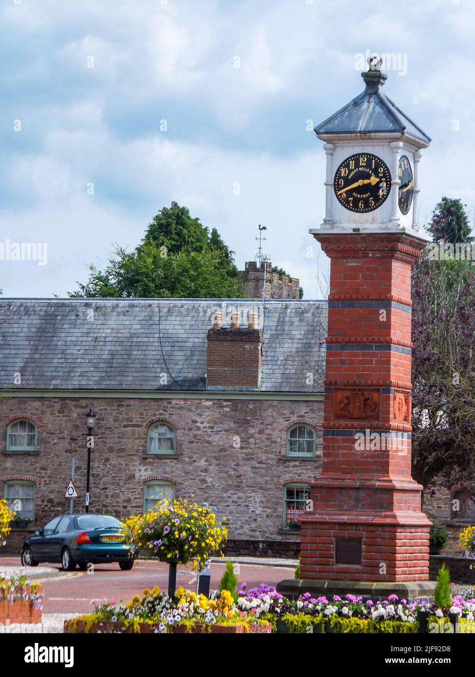 The 1887 Jubilee Clock, by Cheah Chen Eok, is a free standing, square column, Victorian clock tower in Twyn Square, Usk, Monmouthshire, Wales, UK. Stock Photo