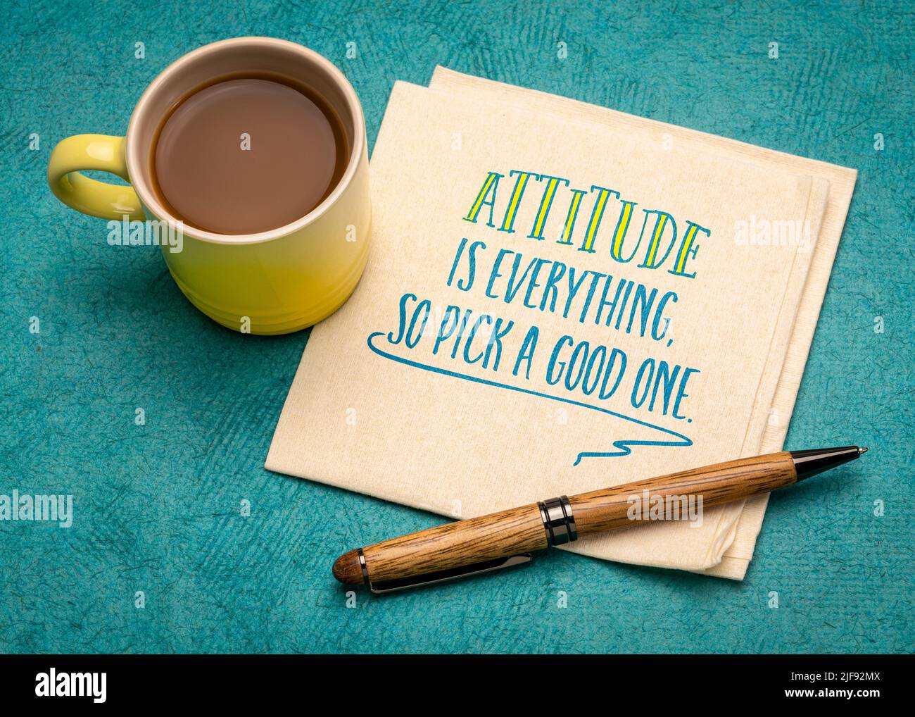 attitude is everything - motivational slogan on a napkin with a cup of coffee, personal development concept Stock Photo