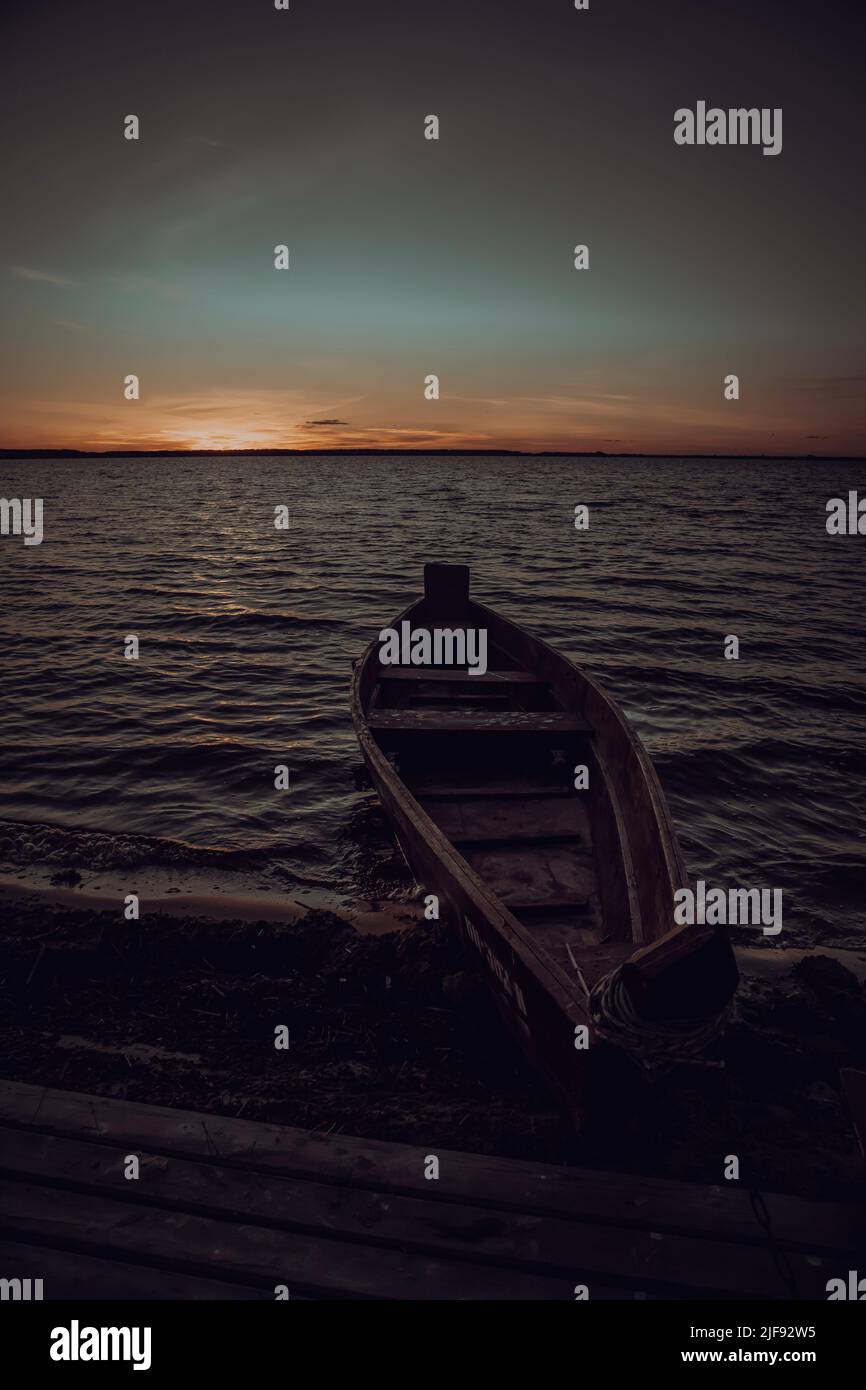 Wooden boat is moored near the lake Stock Photo - Alamy