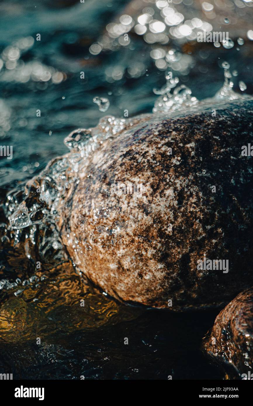 Drips On Rocks Splashing water drops on coastal rocks Stock Photo - Alamy