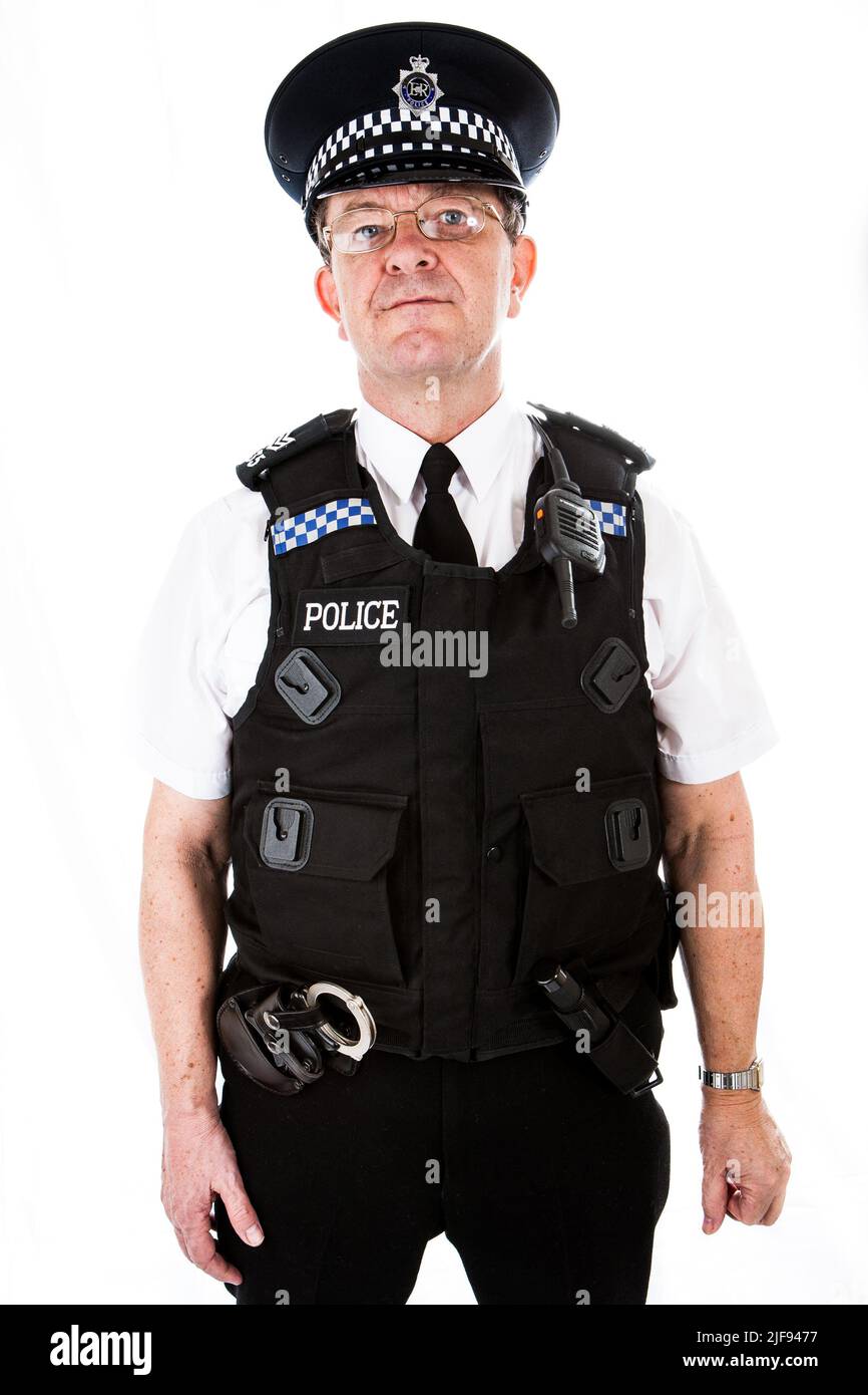 A UK uniformed policeman alert and prepared for duty. Part of a series of images with the same character model. Stock Photo