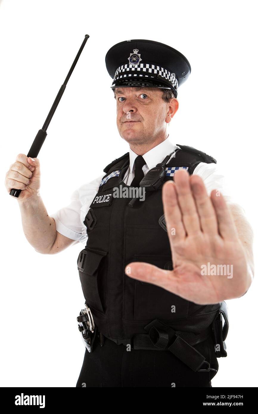 A UK uniformed policeman taking a defensive stance. Part of a series of images with the same character model. Stock Photo