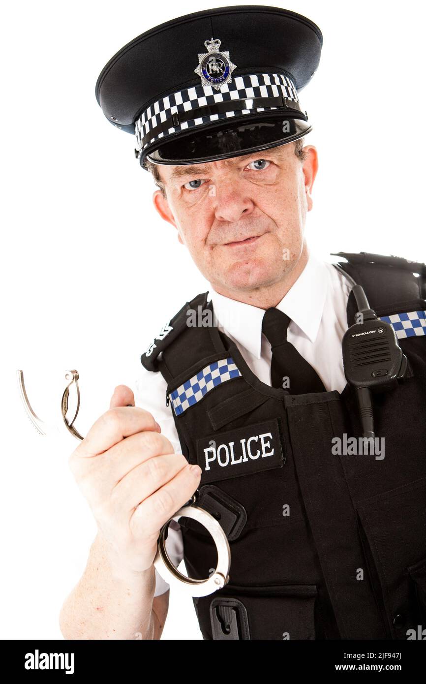 A UK uniformed policeman ready with his handcuffs. Part of a series of images with the same character model. Stock Photo