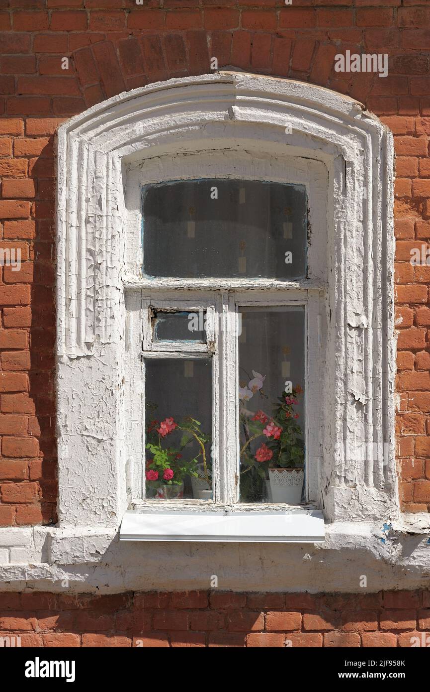 Old window with red brick wall vertical Stock Photo - Alamy