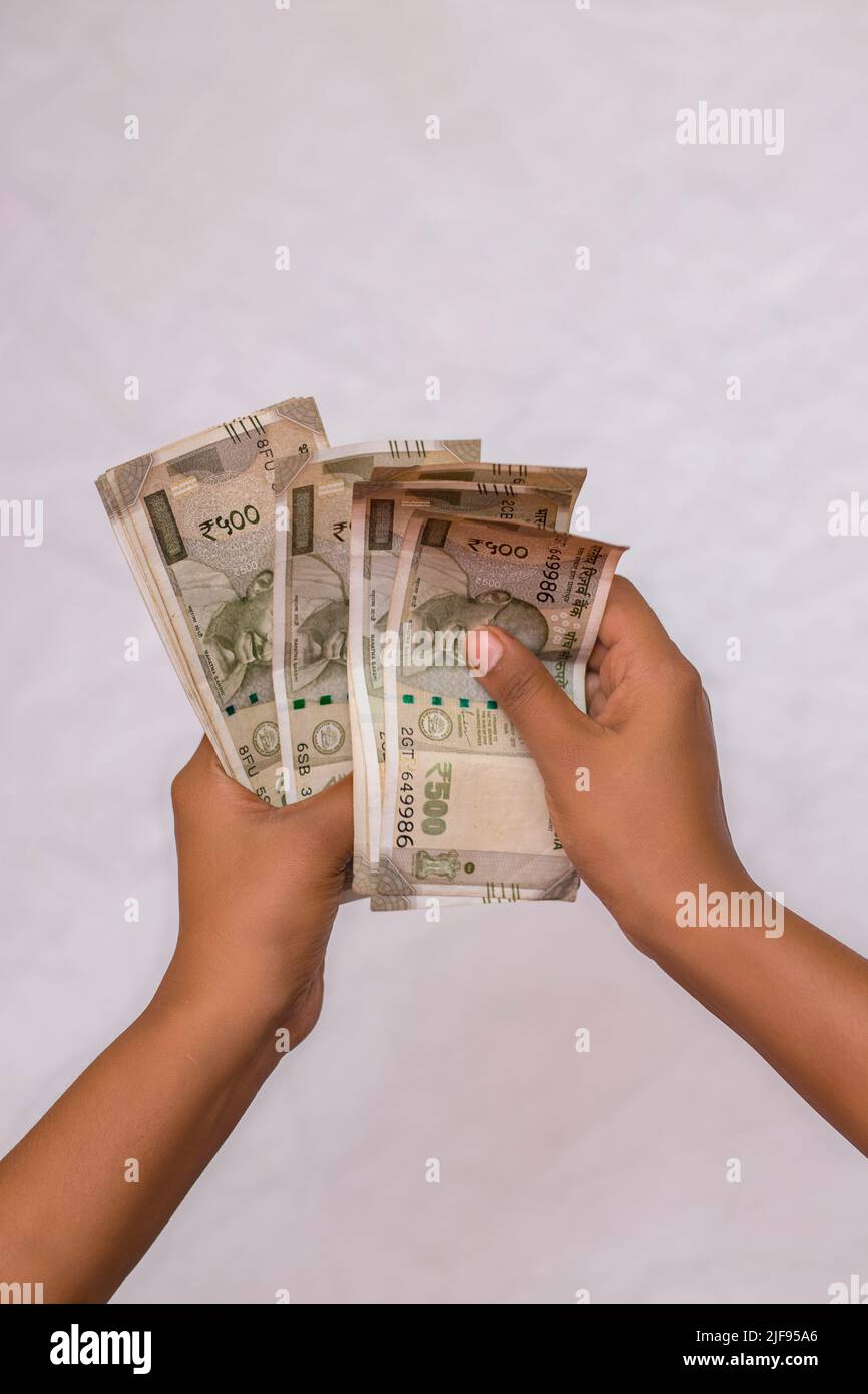 selective focus counting Indian five hundred rupees currency notes. Stock Photo