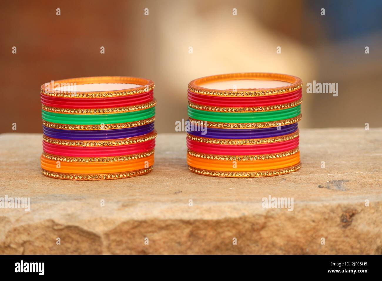 some colorful bangles put on stone Stock Photo