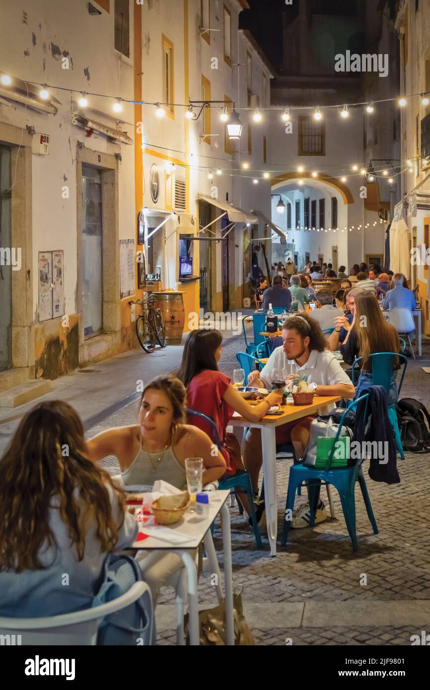 Popular restaurant street Alcarcova de Baixo, Evora, Alentejo, Portugal.  Evora is a UNESCO World Heritage Site. Stock Photo