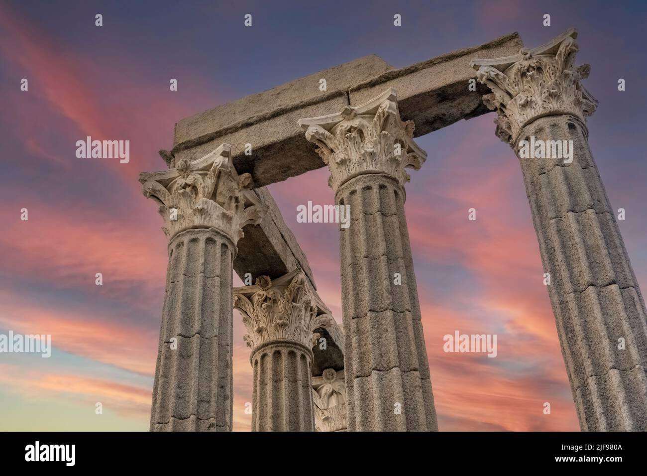 Corinthian columns of the Roman temple of Evora, built around the 1st century.  It is known as the Temple of Diana and dedicated to the Emperor August Stock Photo
