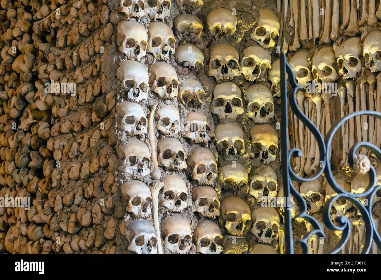 Skulls and bones cemented into the walls of the  17th century Capela dos Ossos - the Chapel of Bones, beside the entrance to  the Church of St. Franci Stock Photo