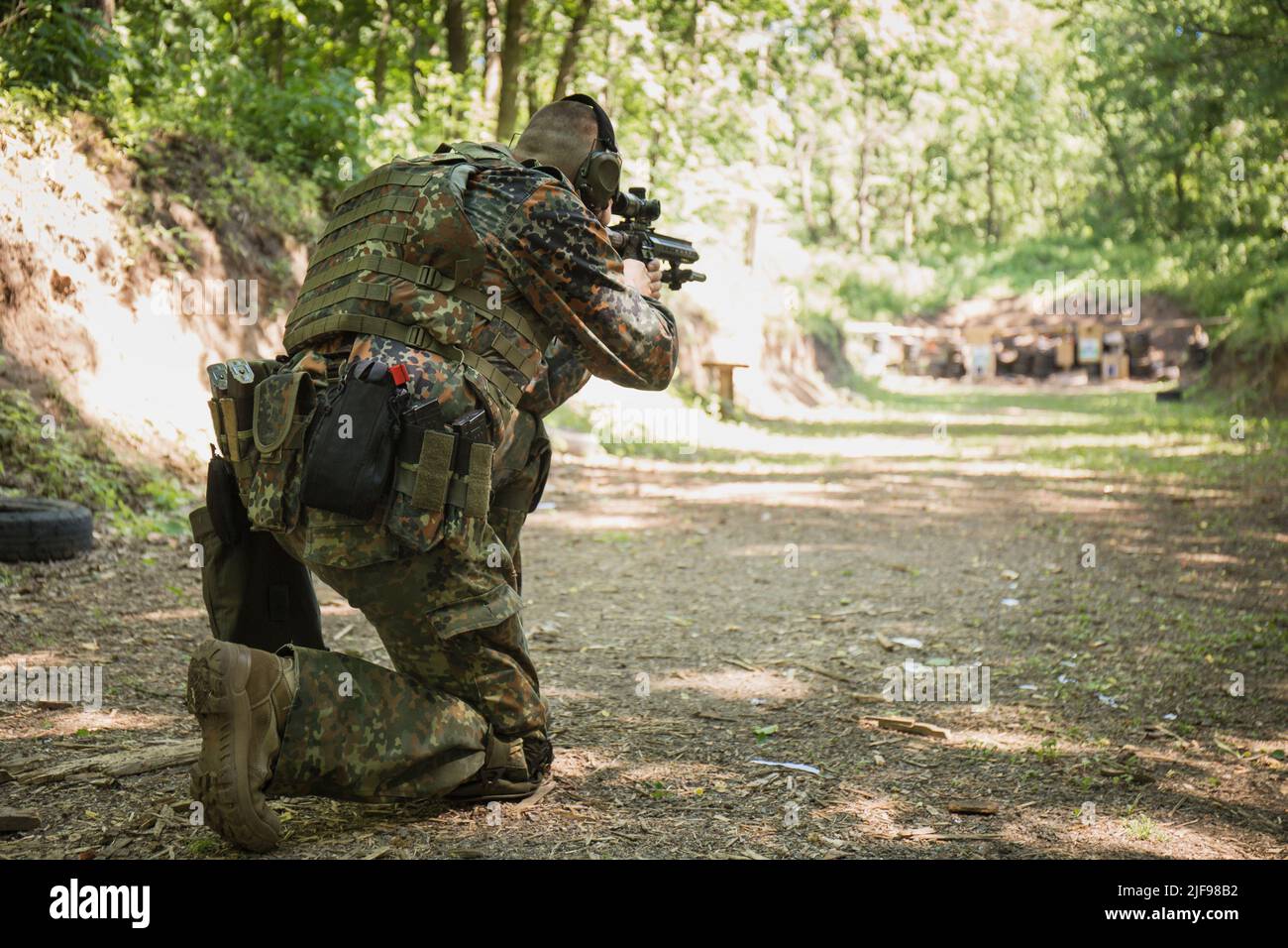 Portrait of a Ukrainian military man with a assault rifle Ar-15 in his ...