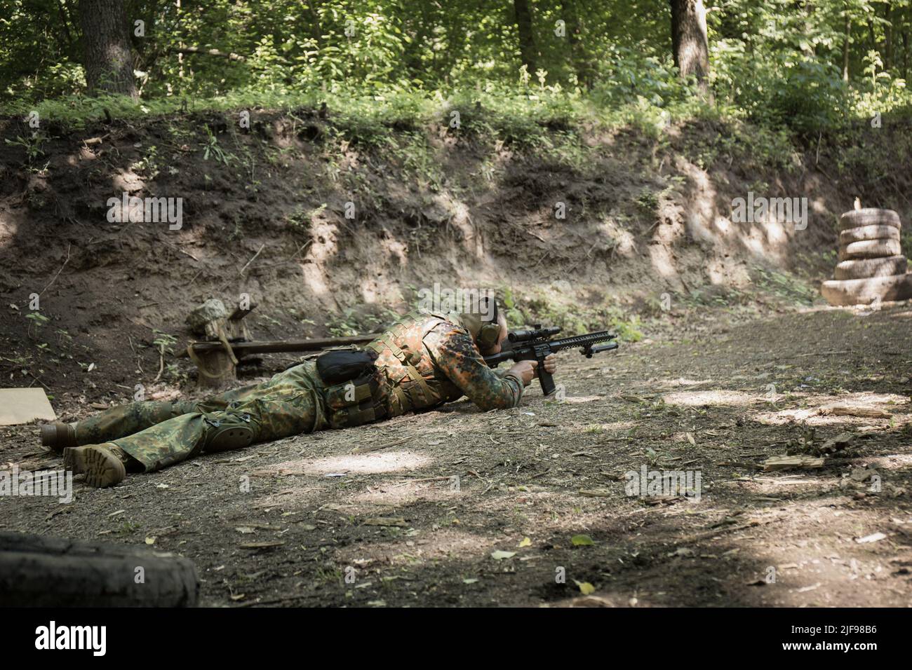 Portrait of a Ukrainian military man with a assault rifle Ar-15 in his ...