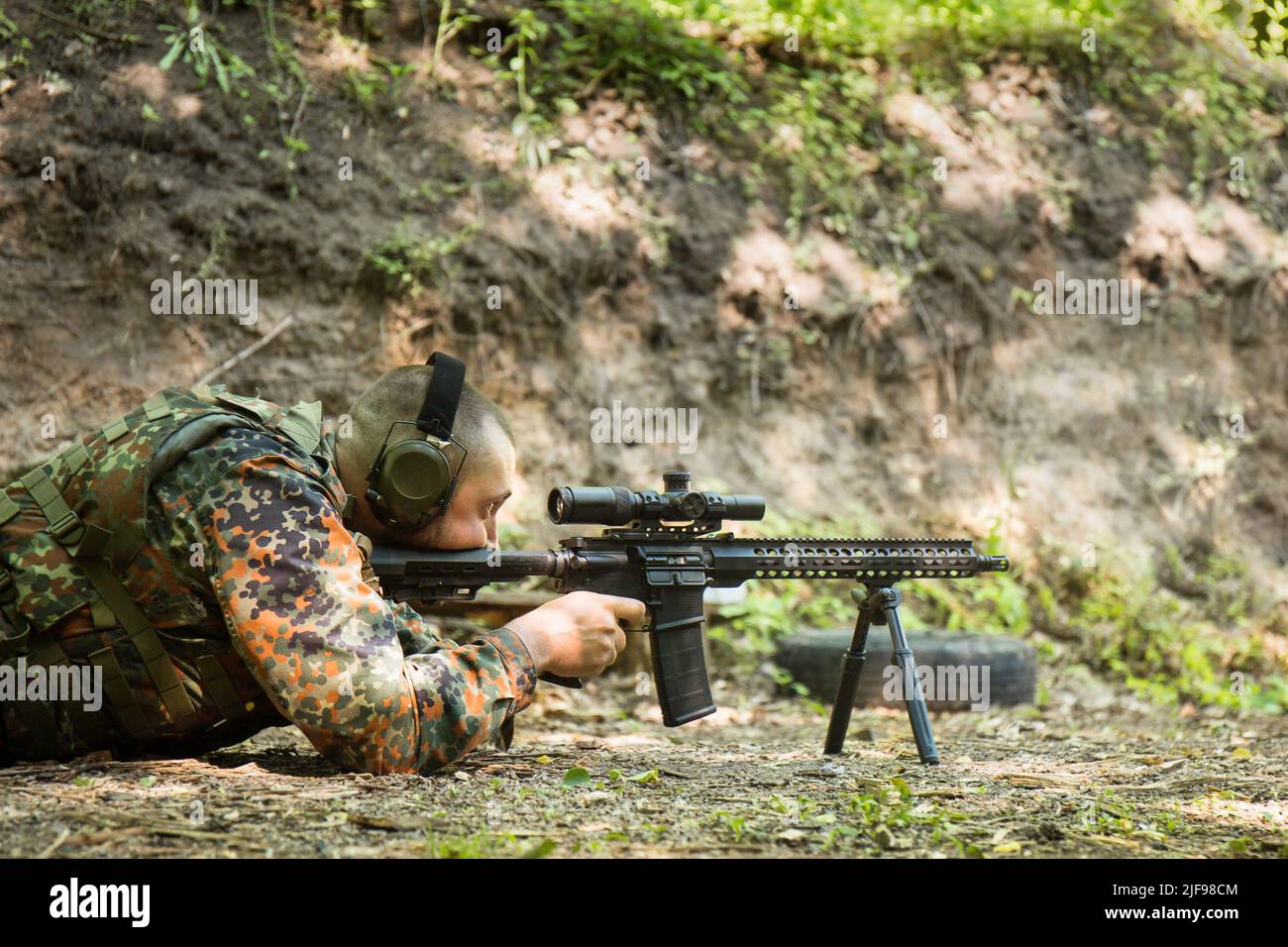Portrait of a Ukrainian military man with a assault rifle Ar-15 in his ...