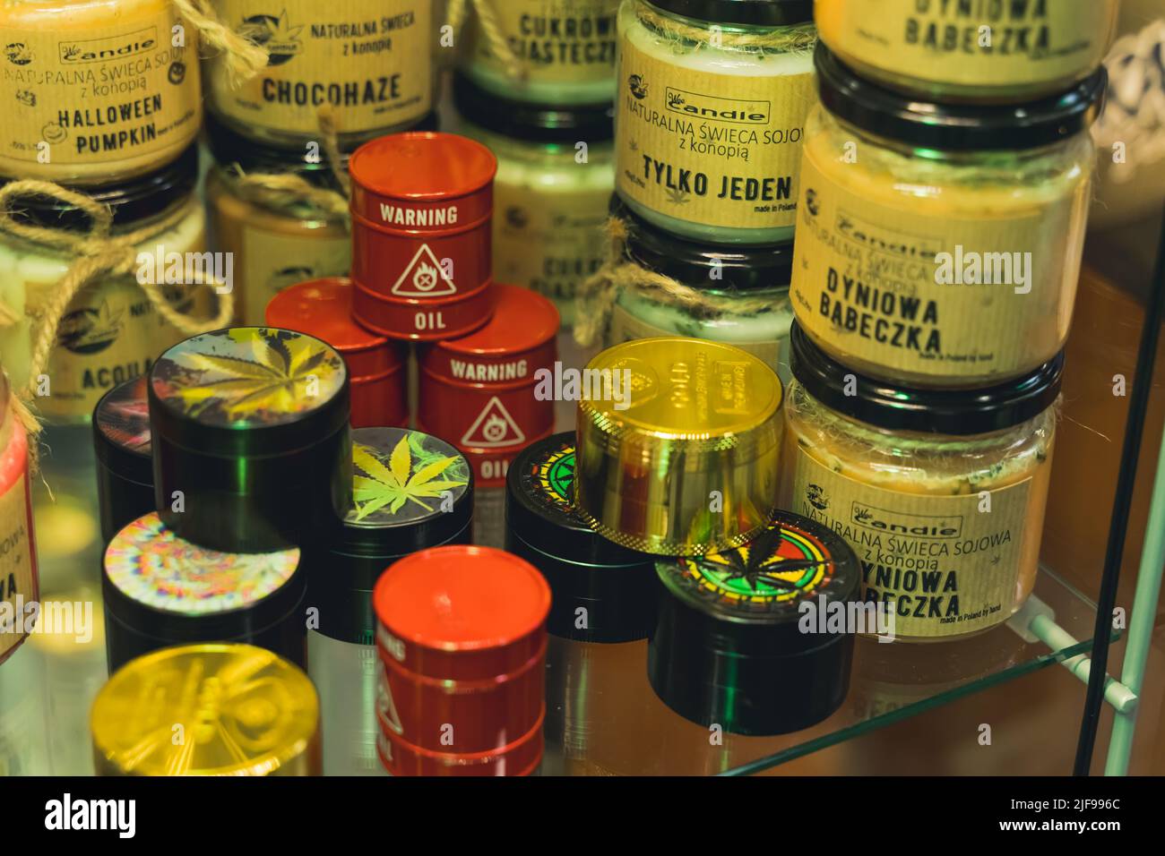 05.28.2022 Warsaw, Poland. Weed crashers and jars of medical CBD marijuana in a shop. Alternative medicine concept. High quality photo Stock Photo