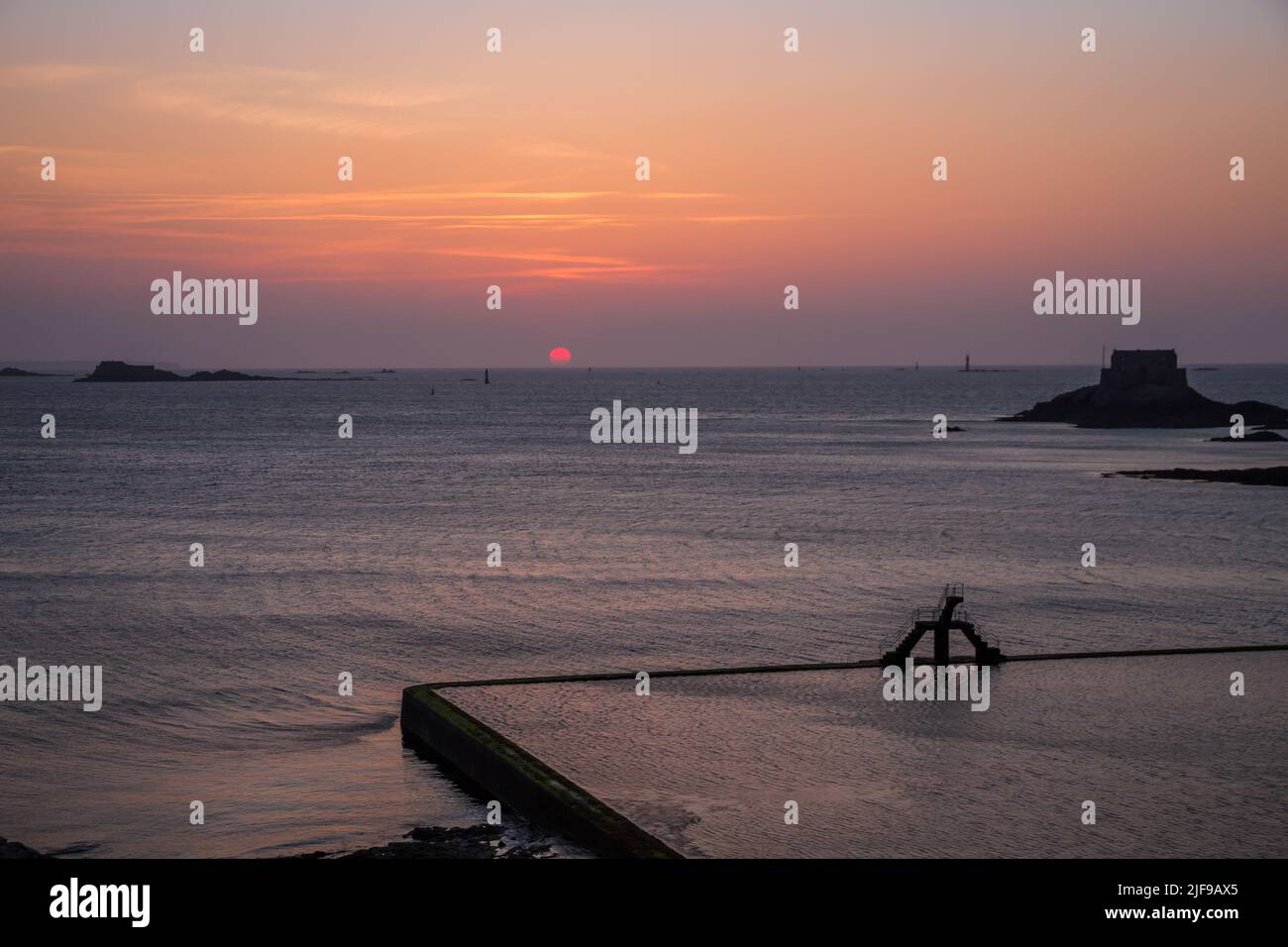 Saint-Malo natural swimming pool and diving at sunset, brittany, France Stock Photo