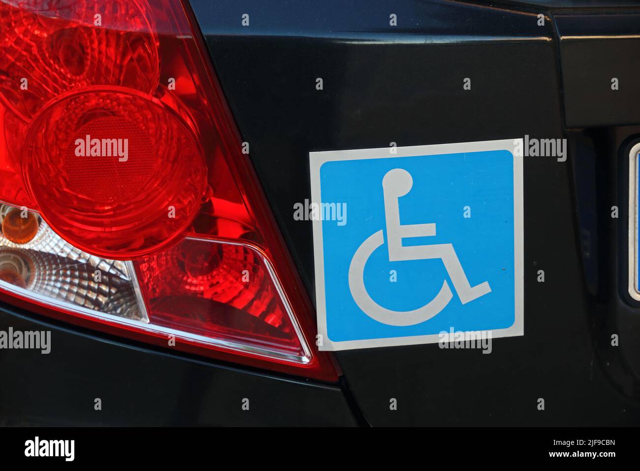 Blue Disabled sticker on rear of car Stock Photo Alamy