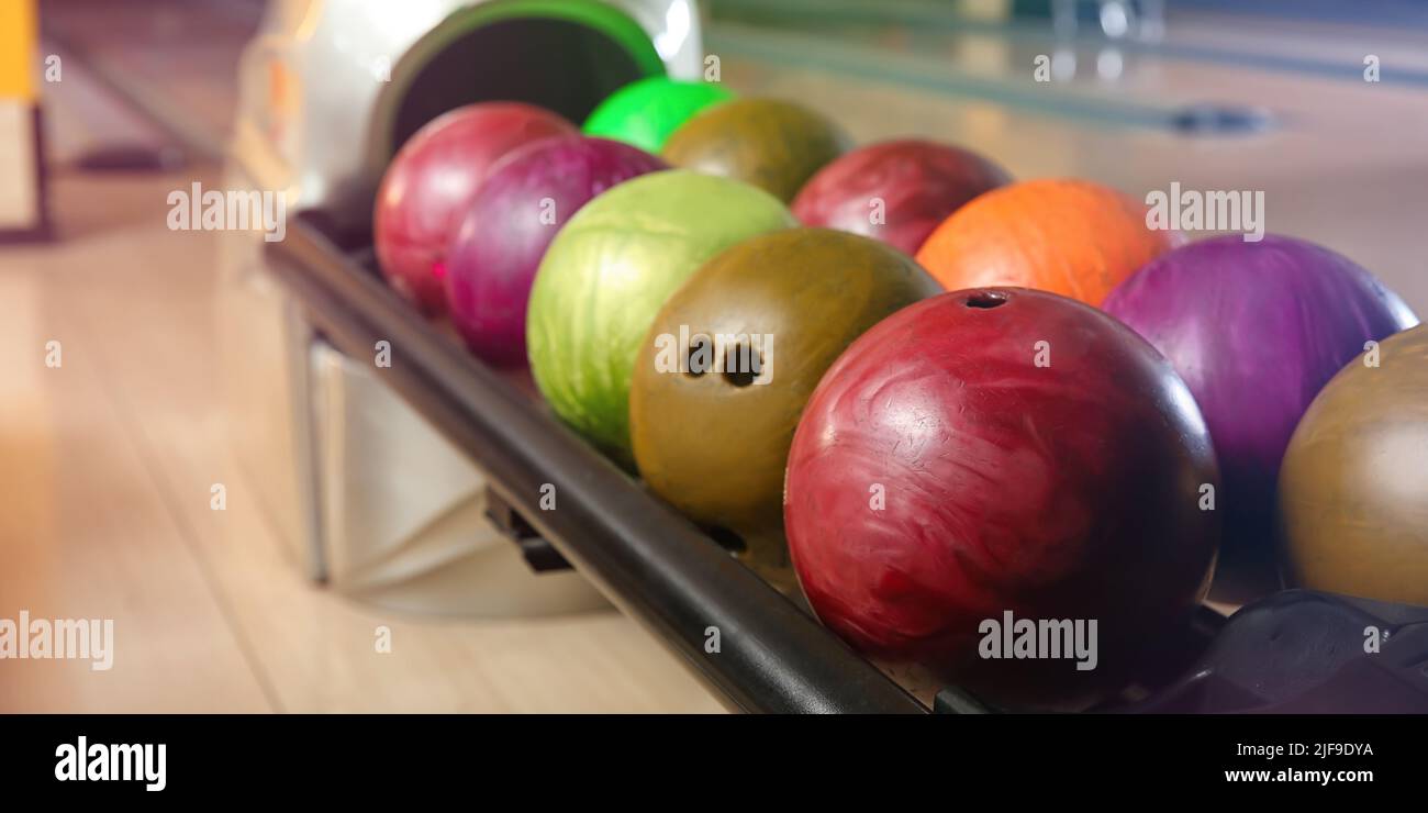 Stand with balls in bowling club Stock Photo Alamy