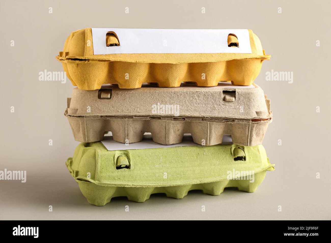 Cardboard holders for eggs on light background Stock Photo Alamy