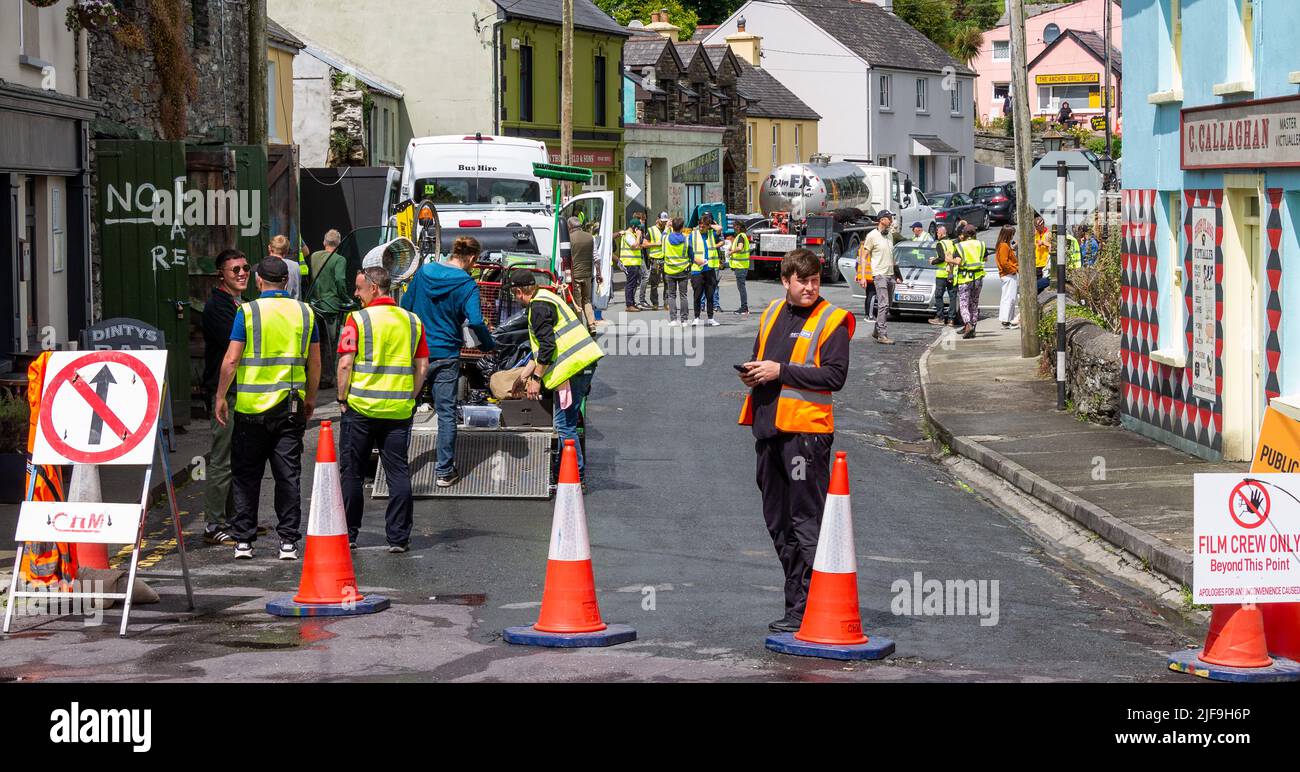 Film crew filming a street scene on location restricting access to film crew only. Stock Photo