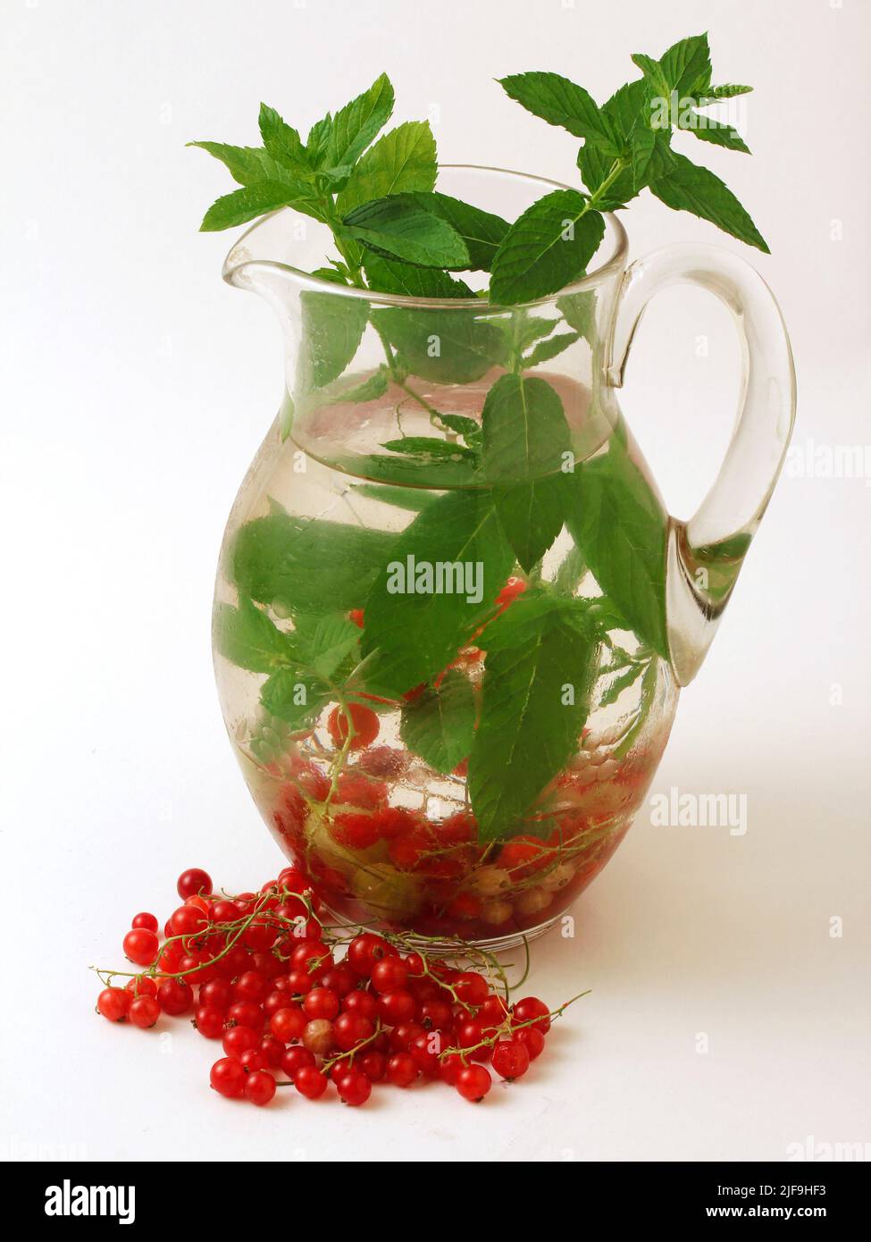 Refreshing water with berries and mint. Stock Photo