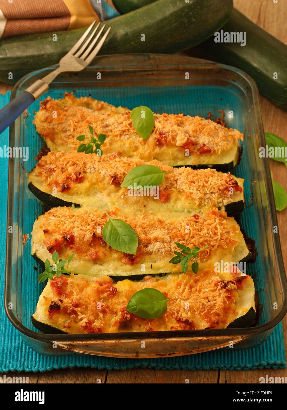 Baked courgettes stuffed with ham and cheese Stock Photo Alamy