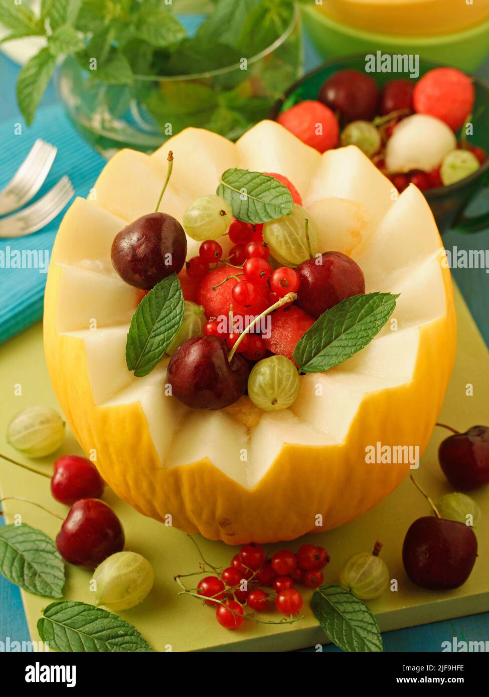 Melon filled with varied fruits. Stock Photo
