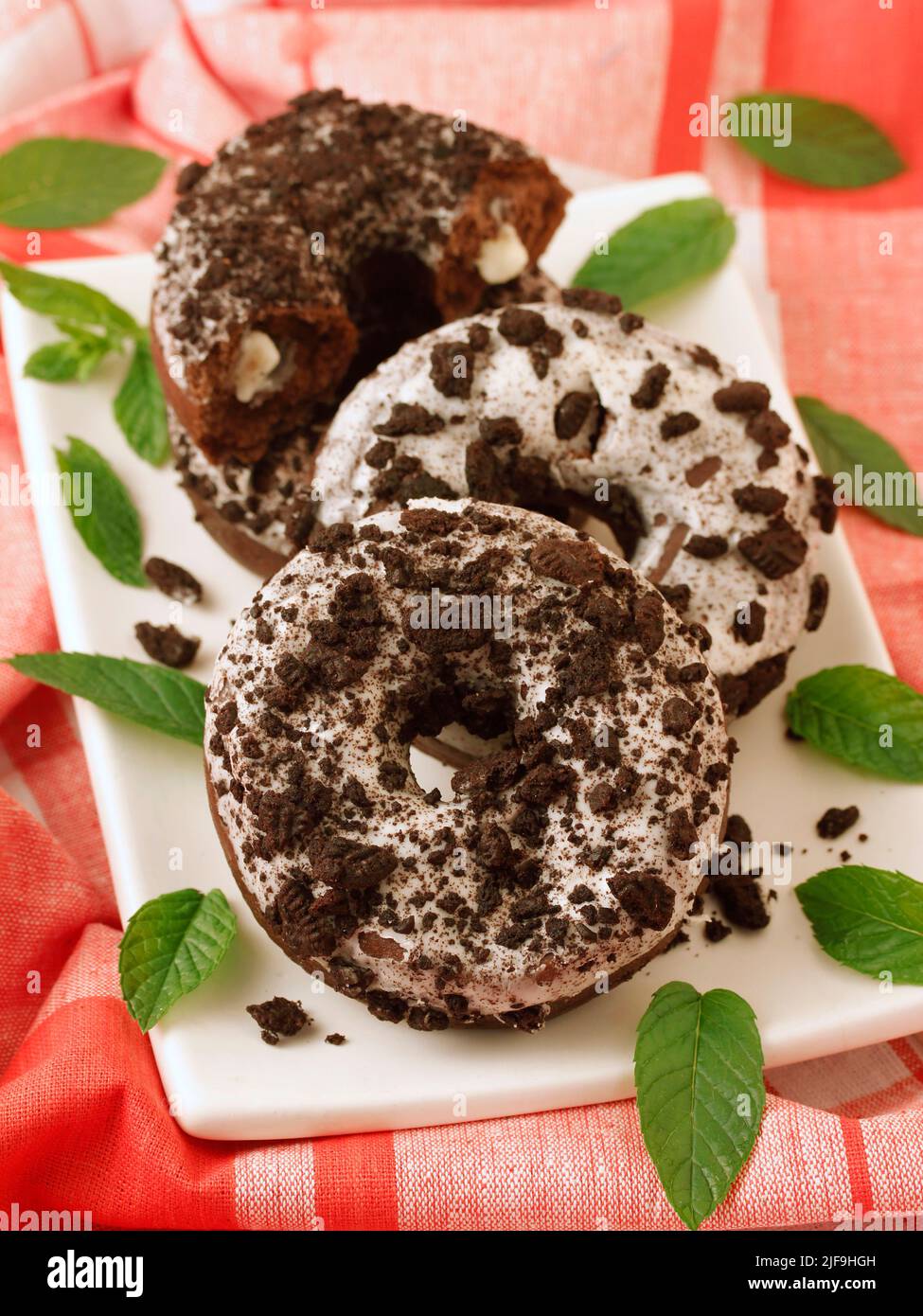 Donuts with chocolate and cream. Stock Photo