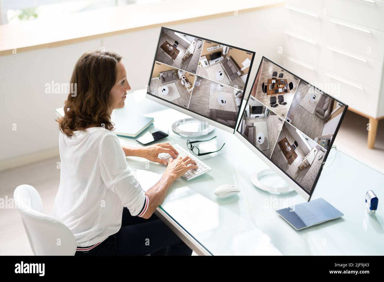 CCTV Security Footage On Multiple Computer Monitors Stock Photo
