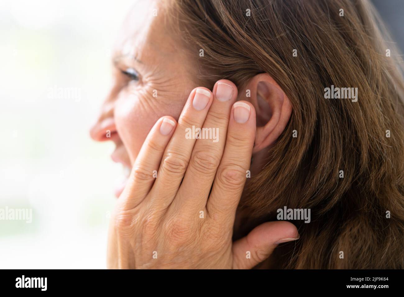 Hearing Aid And Painful Ear Ache. Hearing Issue Stock Photo