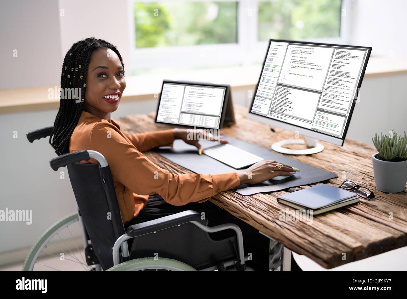 African American Woman Programmer. Girl Coding On Computer Stock Photo