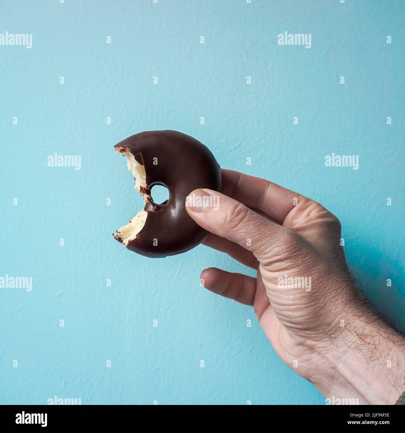 tasty chocolate donut for breakfast, unhealthy food Stock Photo Alamy