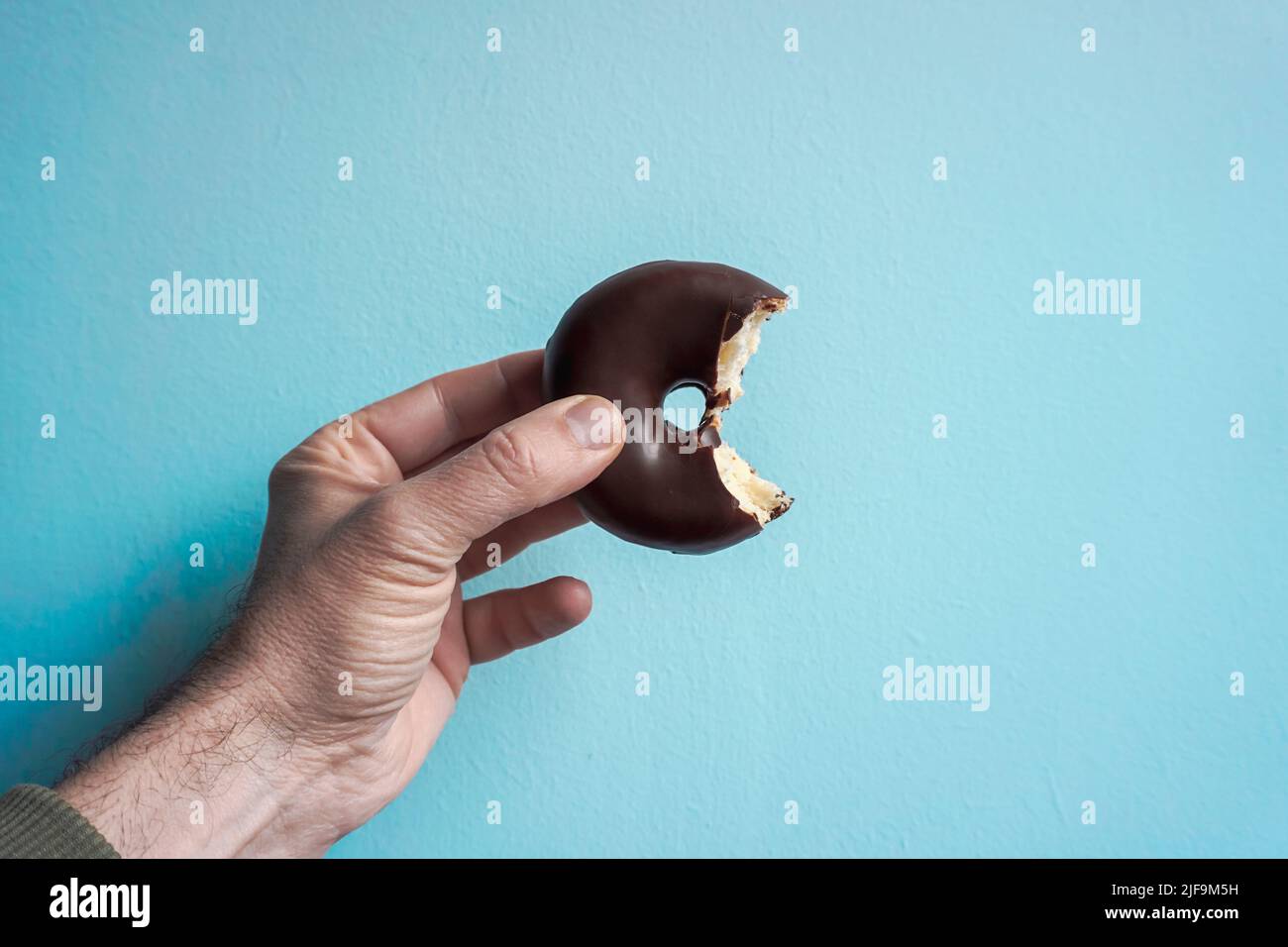 tasty chocolate donut for breakfast, unhealthy food Stock Photo Alamy