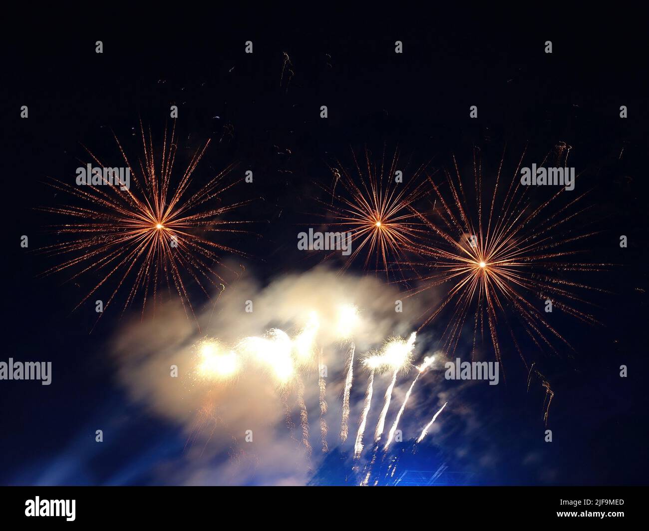 Beautiful fireworks explosion on the dark night sky Stock Photo - Alamy