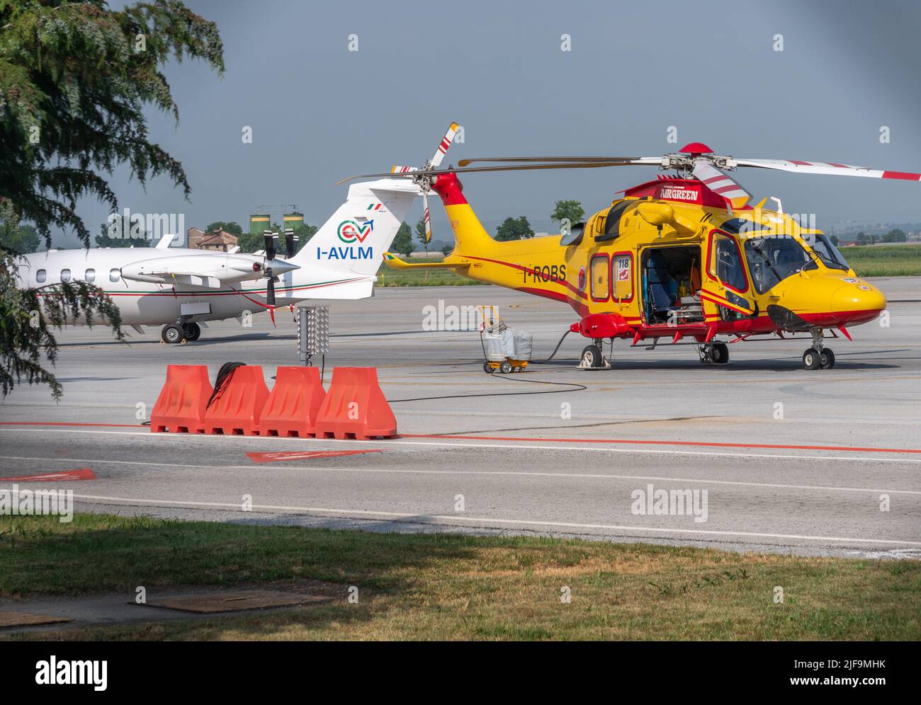 Cuneo, Italy, - June 27, 2022: the regional rescue helicopter parked in the Cuneo airport, headquarters of the Maxiemergenza 118 (maxi emergency) Stock Photo