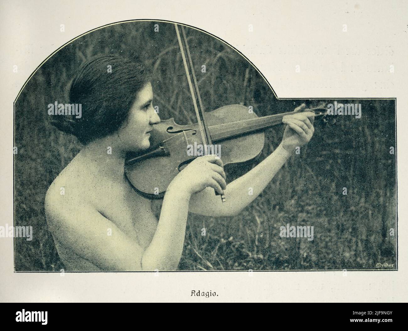 Early vintage photograph of a nude woman playing the violin, violinist, German, 1900s. Study of female beauty. Adagio Stock Photo
