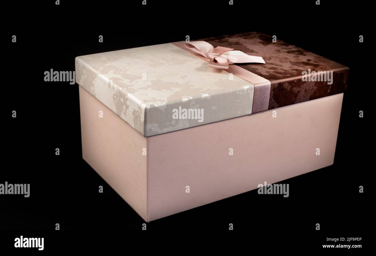Black friday gift box with pink bow on black background. Copy space. Horizontal, banner, postcard Stock Photo