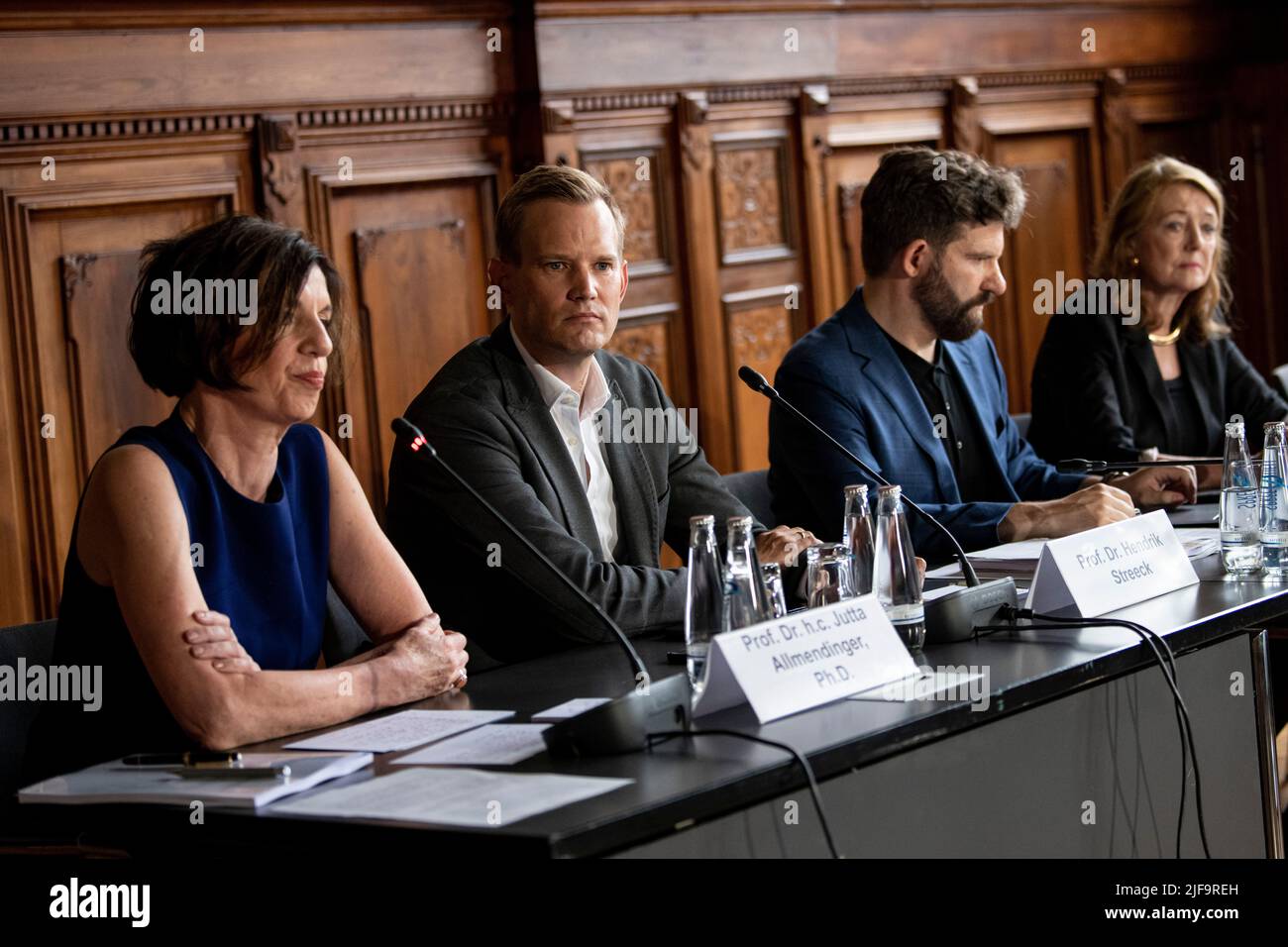 Berlin, Germany. 01st July, 2022. Jutta Allmendinger (l-r), sociologist, Hendrik Streeck, virologist, Harald Wilkoszewski, Head of Communications and Press Officer of the WZB, and Helga Rübsamen-Schaeff, virologist and chemist, attend a press conference of the Expert Committee for the Evaluation of the Infection Protection Act (IfSG). The IfSG presents the results of the evaluation report on the Corona protection measures to date. Credit: Fabian Sommer/dpa/Alamy Live News Stock Photo