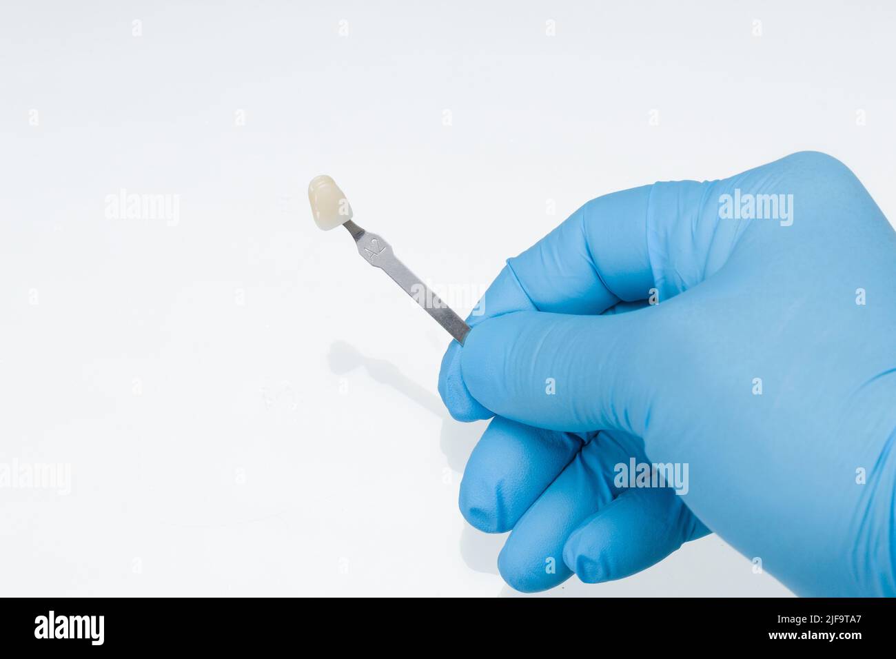 Close-up of shade guide to check veneer of tooth crown in a dental laboratory for correct tonality Stock Photo